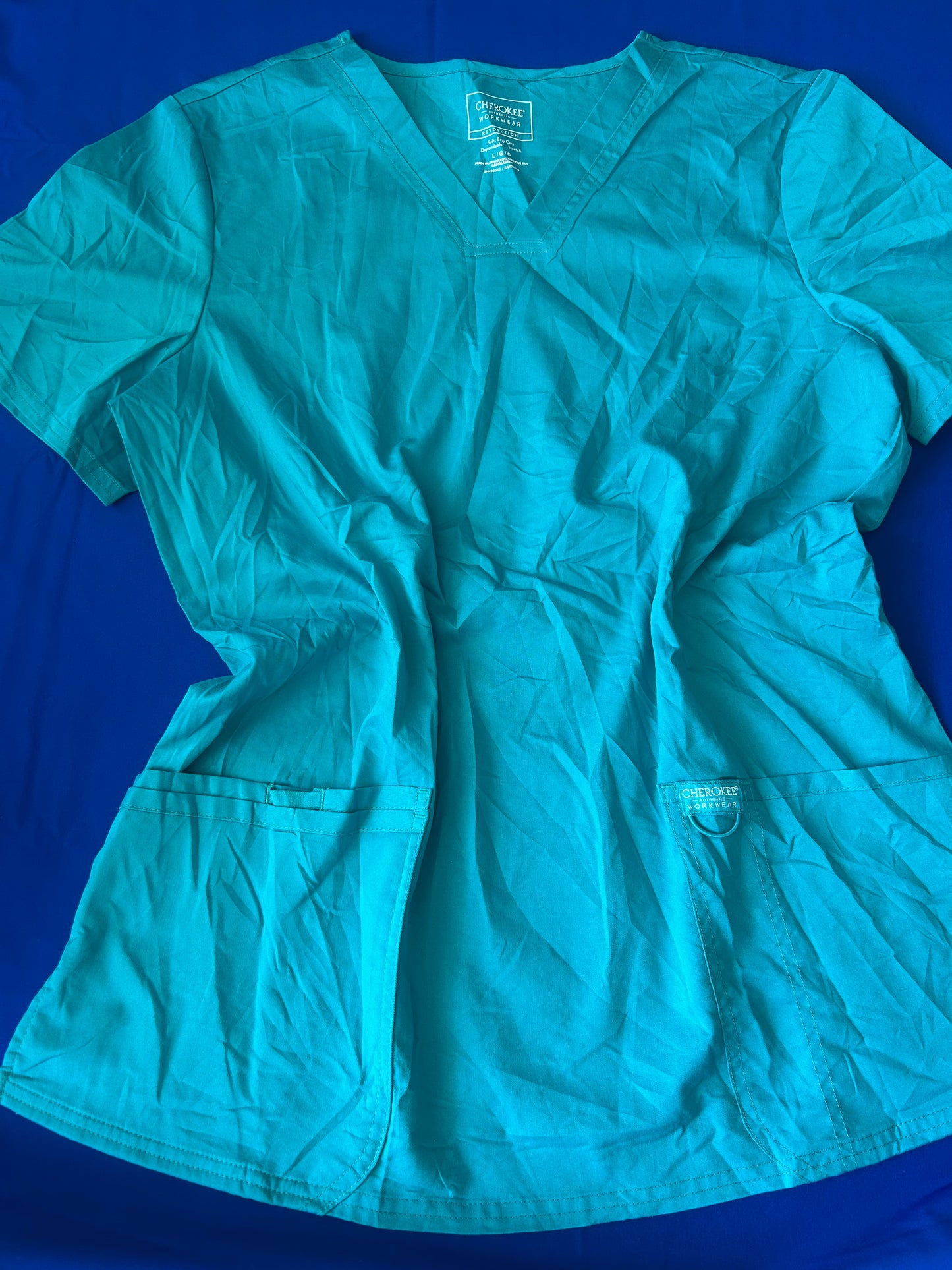 Delantal turquesa Cherokee talla L